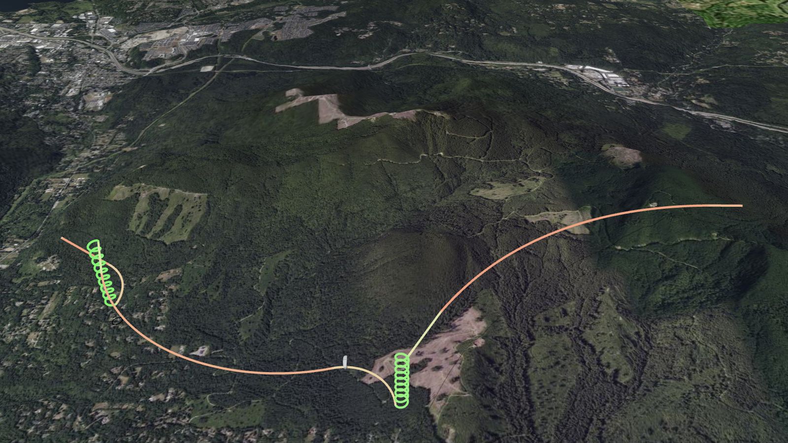 A paraglider flight replayed in 3D over Tiger Mountain, the track drawn over satellite terrain and coloured green where the pilot climbed.